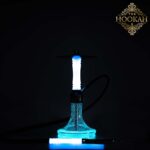 THE HOOKAH 2Pac Woodoo – Eine leuchtende InnovationDie THE HOOKAH 2Pac Woodoo ist nicht nur eine Shisha – sie ist eine Hommage an Innovation und Kreativität. Hier einige Highlights: 	V2A Edelstahl x Epoxidharz mit Magischen Partikeln: Diese Kombination schafft nicht nur eine robuste und elegante Optik